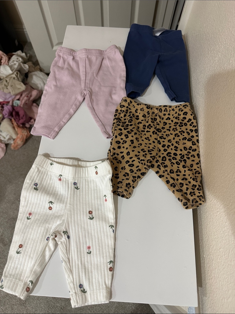 Carter's White Ribbed Newborn Pants with Small Multicolor Prints